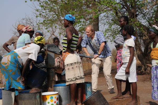 I take a turn at the well (I'm later told only women pump water and carry water)