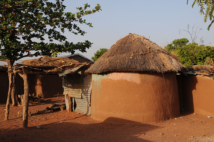 Circular mud huts with thatched roofs